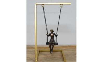 Woman on Swing Sculpture
